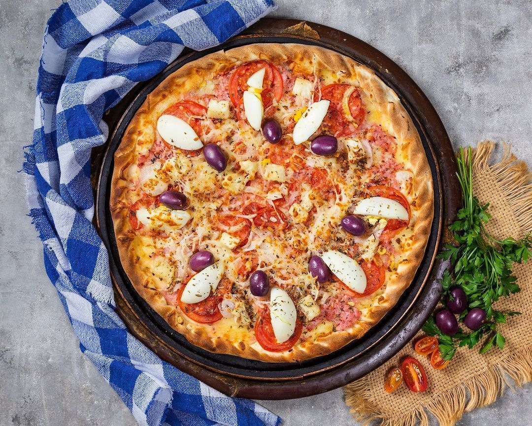 Pizza de Carne Louca: conheça a pizzaria Parada do Cardoso, em BH, que aposta em sabores exóticos