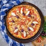 Pizza de Carne Louca: conheça a pizzaria Parada do Cardoso, em BH, que aposta em sabores exóticos