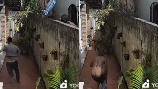 Imagens mostram homem sendo perseguido após pular muro