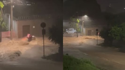 Motociclista luta contra enxurrada durante tempestade em Lagoa Santa nesta segunda (15)