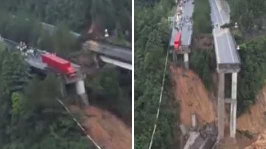 Caminhão ficou com a cabine suspensa após queda de ponte