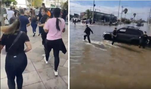 Foto mostra moradores do Rio Grande do Sul correndo de água