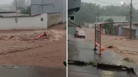 Foto mostra rua tomada pela água em Mateus Leme (MG)