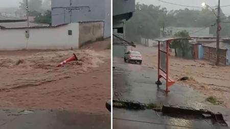 Foto mostra rua tomada pela água em Mateus Leme (MG)