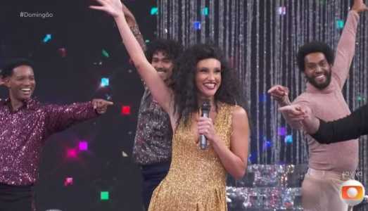 Débora Nascimento dubla Diana Ross no Domingão Com Huck