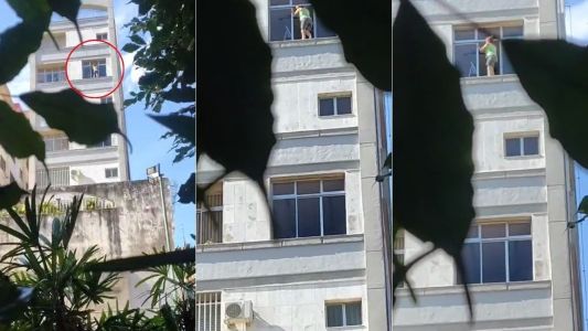Mulher se arrisca para limpar janela em BH