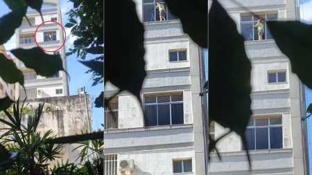 Mulher se arrisca para limpar janela em BH
