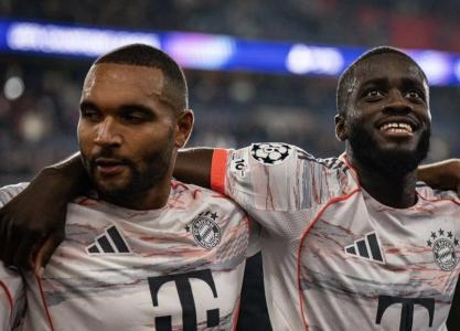 Jonathan Tah e Dayot Upamecano após jogo do Bayern na Champions 2025/2026