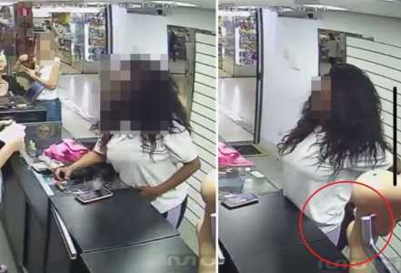Foto mostra suspeita enfiando mechas de cabelo na parte de trás da calça em loja em Belo Horizonte