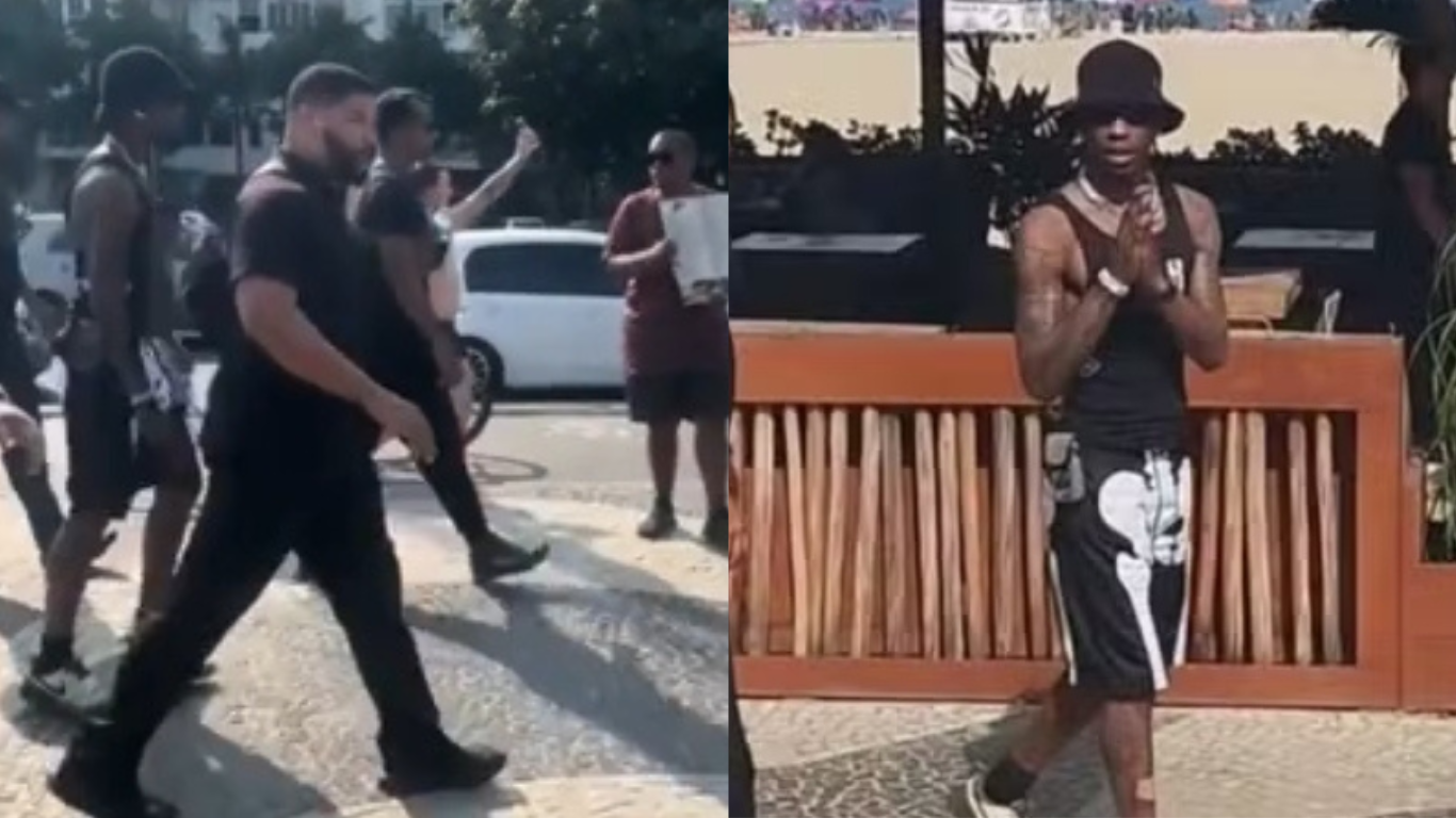 Travis Scott passeia pela praia de Copacabana cercado de seguranças