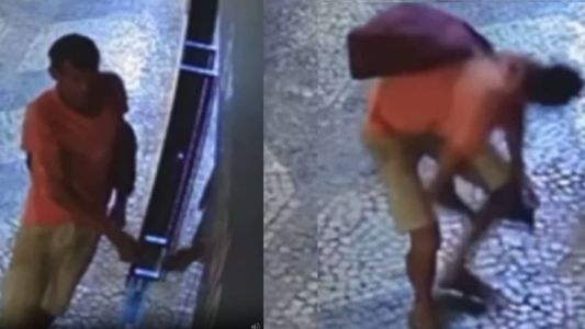 Imagem mostra suspeito 'pescando' roupas durante a madrugada