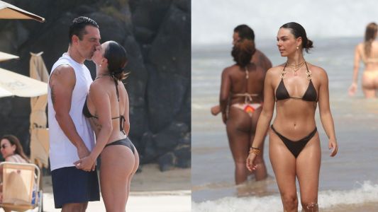 Marcus Buaiz e Isis Valverde curtem último dia do ano em Noronha