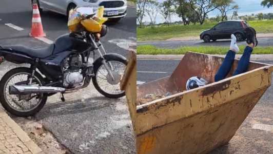 Vídeo: motociclista se distrai com sacola e vai parar dentro de caçamba no interior de Minas