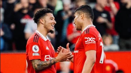 Sancho (esq) e Casemiro (dir), do United