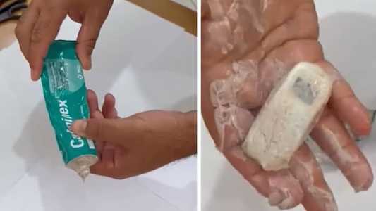 Vídeo mostra agente retirando minicelular de dentro de pomada