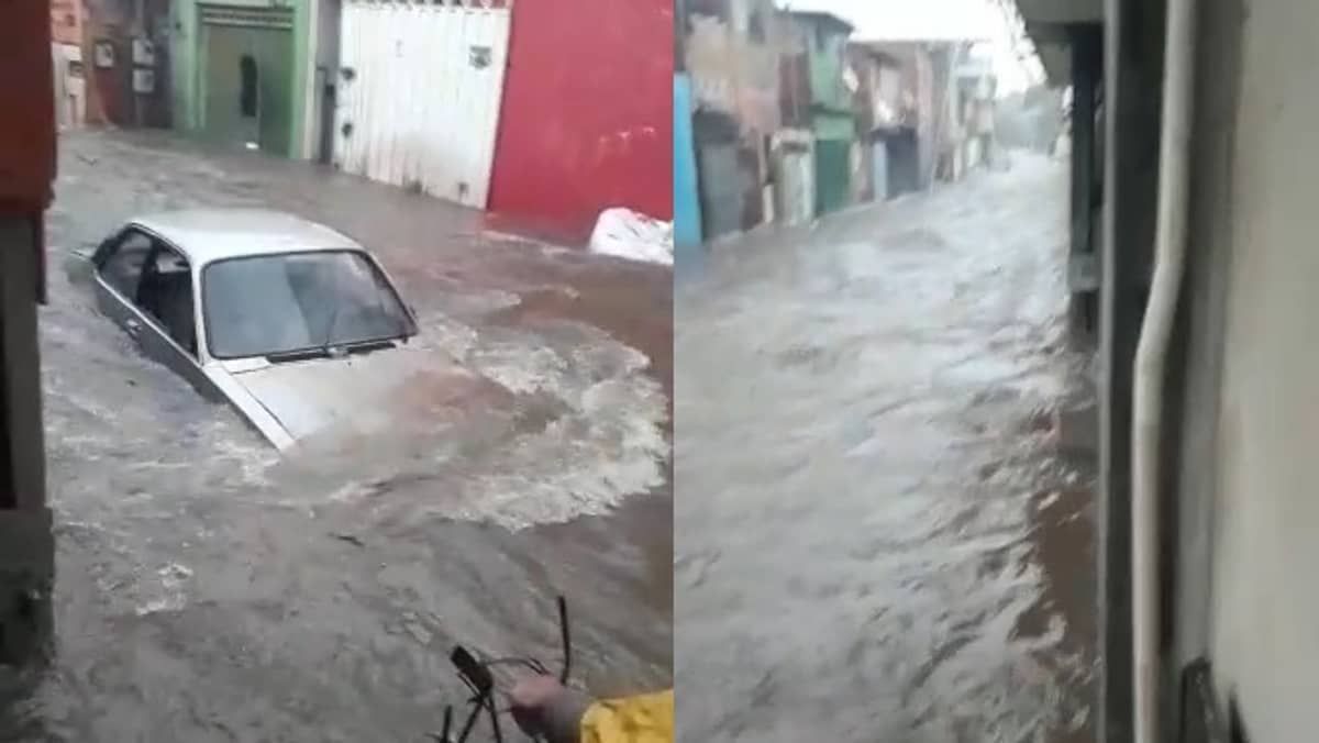 Chuva forte deixa família ilhada na Vila Barraginha, em Contagem; vídeo mostra carro arrastado na Vila Samag