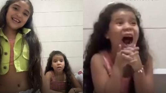 Imagens mostram menina ajudando a irmã arrancar dente com ajuda de cachorro