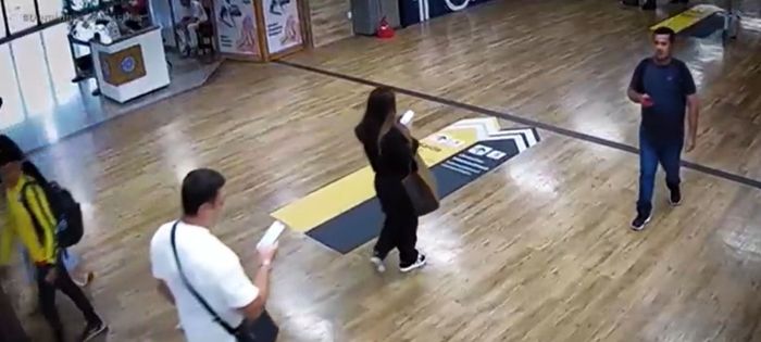A namorada do empresário, Maria Helena, aparece no vídeo de roupa preta. O delator do PCC de blusa branca horas antes de ser assassinado.