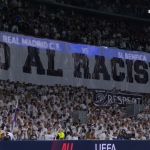 Torcida do Real Madrid exibe faixas antirracistas antes de jogo contra o Benfica