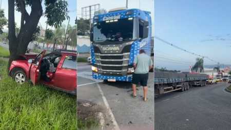 Batida com carreta lança carro contra árvore e trava trânsito em Contagem; veja vídeo