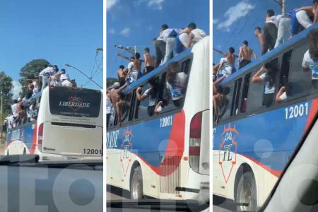 Vídeo mostra torcedores do Cruzeiro 'surfando' em cima de ônibus na Grande BH