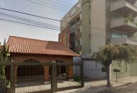 Muro entre casa e prédio em MG viraliza; saiba a história por trás da construção