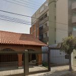 Muro entre casa e prédio em MG viraliza; saiba a história por trás da construção