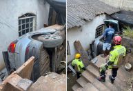 Mulher perde controle de carro, desce barranco e cai entre casas na Grande BH