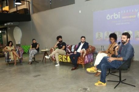 O CEO do Órbi ICT, Christiano Xavier, ao falar sobre a Lagoinha em painel do Órbi de Portas Abertas • Camila Rocha