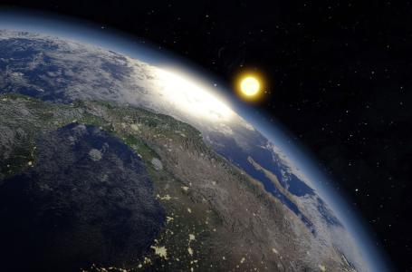 Representação do planeta Terra com vista do Sol ao fundo