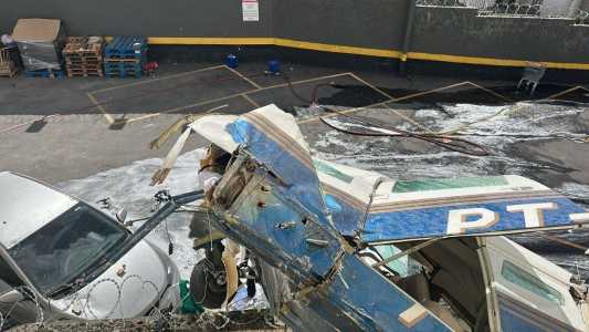 Imagens mostram destroços do avião em prédio de BH