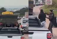 Homem que pegava carona em caminhão é derrubado e agredido por policial na BR-040; veja vídeo