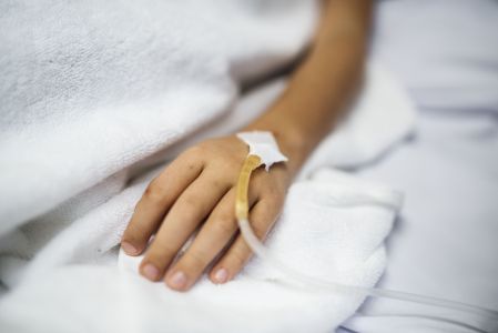 Closeup of hand with IV tube