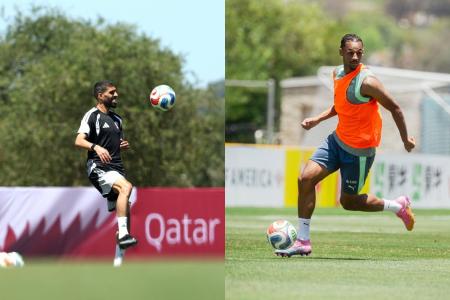 Hassan Al-Haydos (à esquerda), da Seleção Catari, e Djibril Sow (à direita), da Seleção Suíça