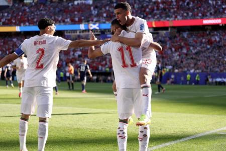 Seleção Marroquina comemora gol contra Escócia