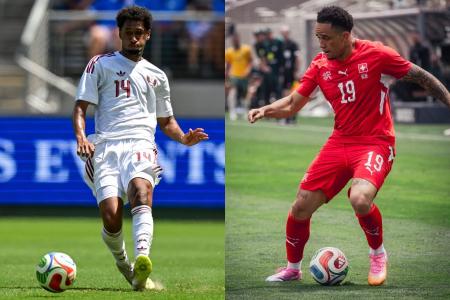 Homam à esquerda), da Seleção Catari, e Noah Okafor (à direita), da Seleção Suíça