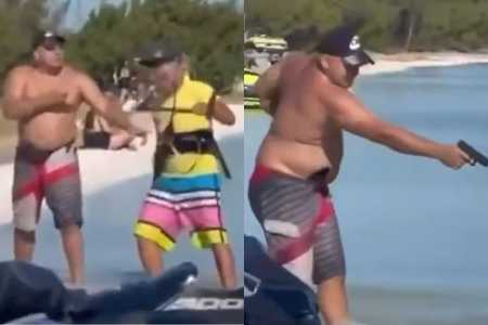 Vídeo banhista aponta arma para velejador, tenta atirar duas vezes, mas disparo falha no RJ