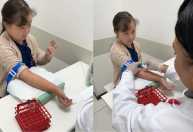 Vídeo de garotinha com síndrome de Down colhendo sangue viraliza: ‘Sempre nos ensina’, diz mãe