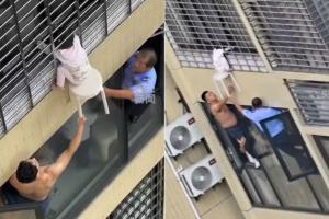Vídeo: criança fica pendurada no 12º andar na China e vizinhos ajudam em resgate; assista